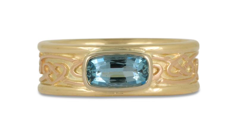 This One of a Kind Weaving Hearts Ring is a two tone rose gold and yellow gold ring, featuring a beautiful aquamarine.